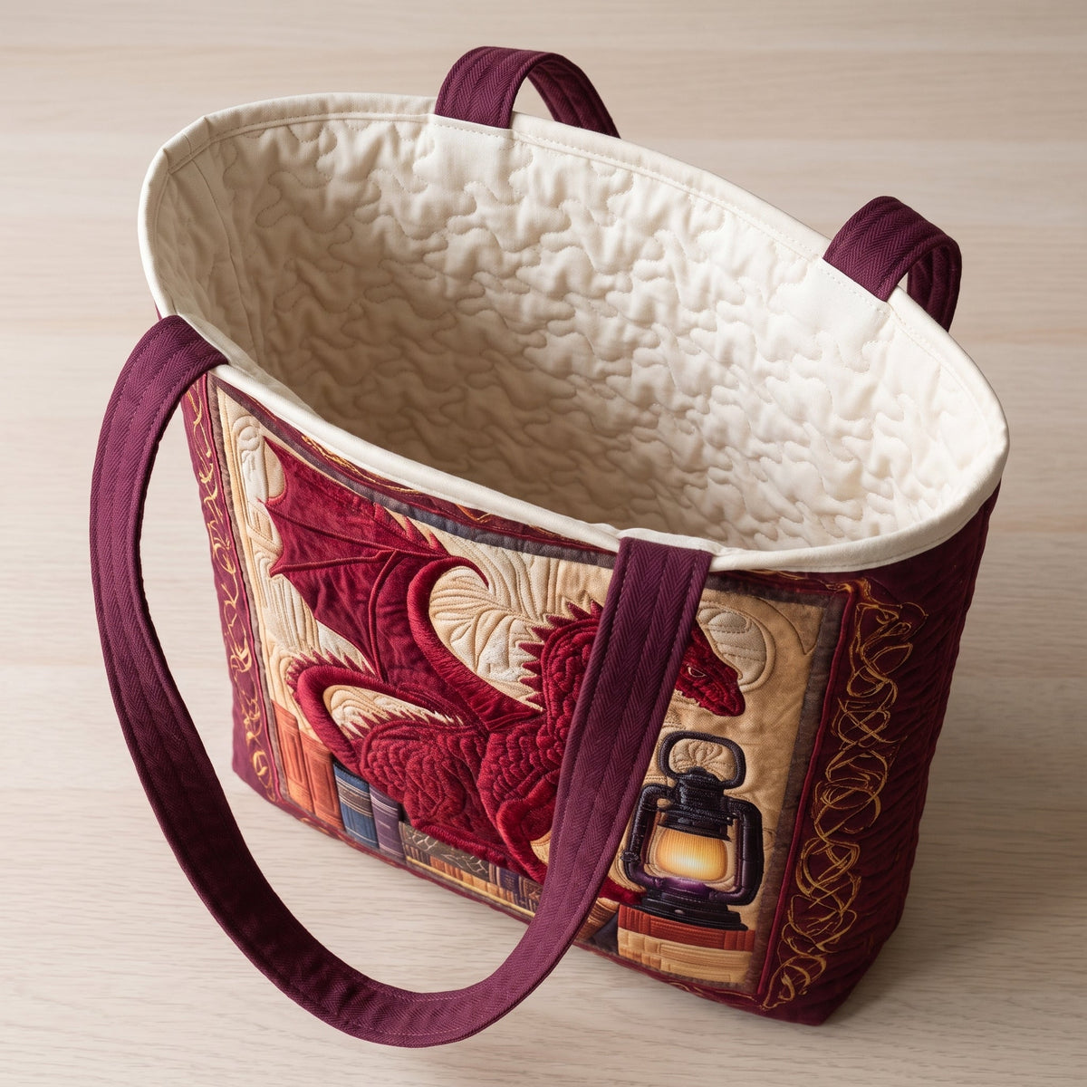 Book Guardian Quilted Tote Bag — open, showing the plain cream quilted lining