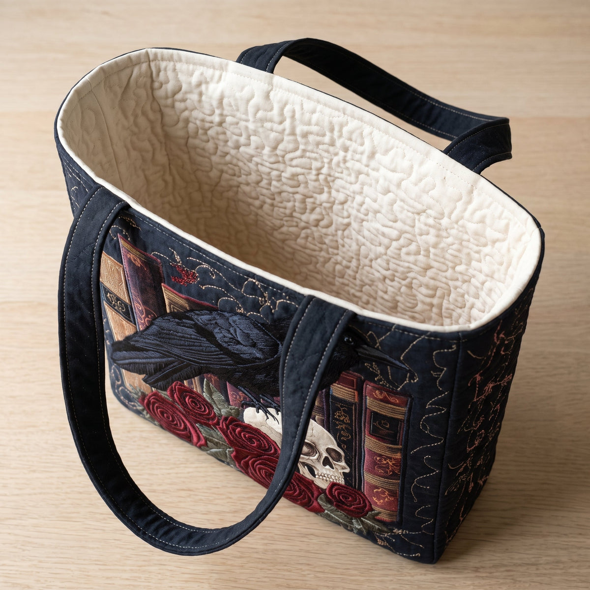 Mystic Raven Book Quilted Tote Bag — open, showing the plain cream quilted lining