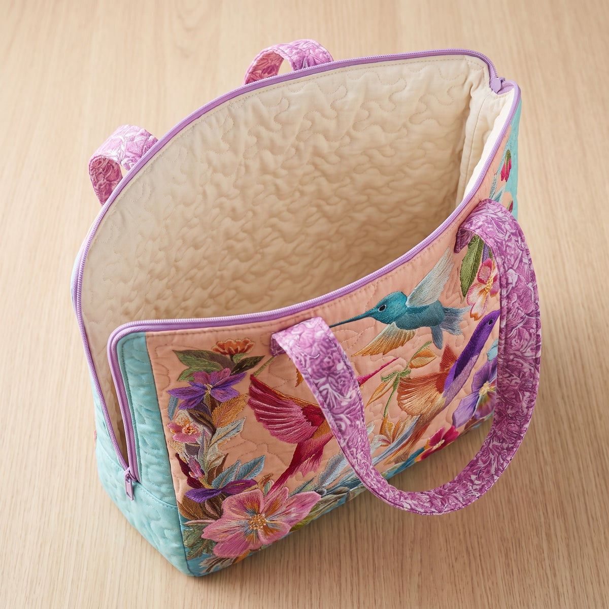 Hummingbird Flower Quilted Tote Bag — open, showing the plain cream quilted lining