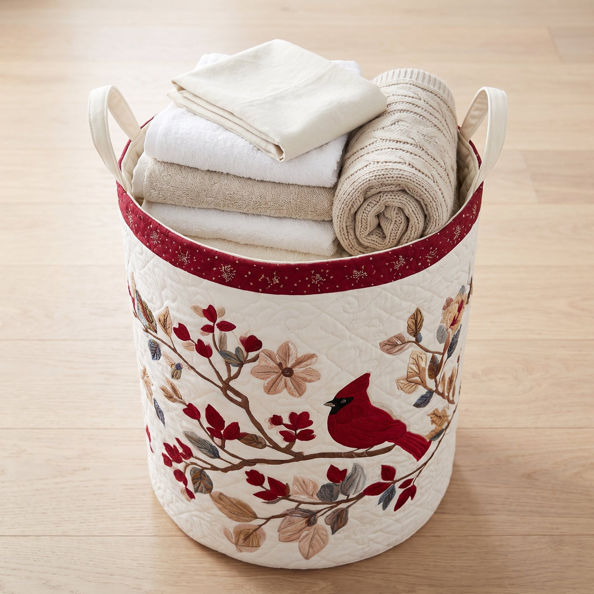 Quilted Laundry Basket - Carmine Leaves — filled with folded towels and laundry