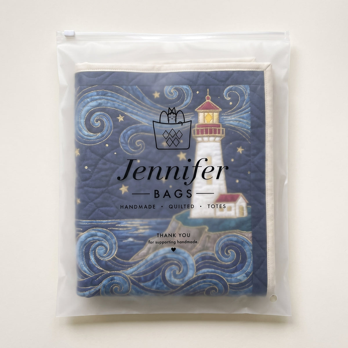Quilted Laundry Basket - Lighthouse at Dusk — packaged in its pouch