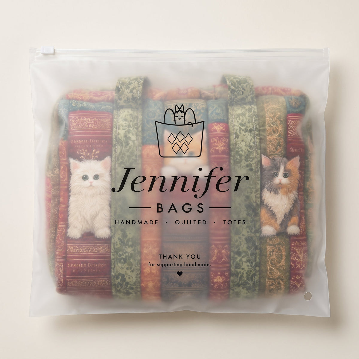 Cat Chapter Quilted Duffle Bag — packaged in its pouch