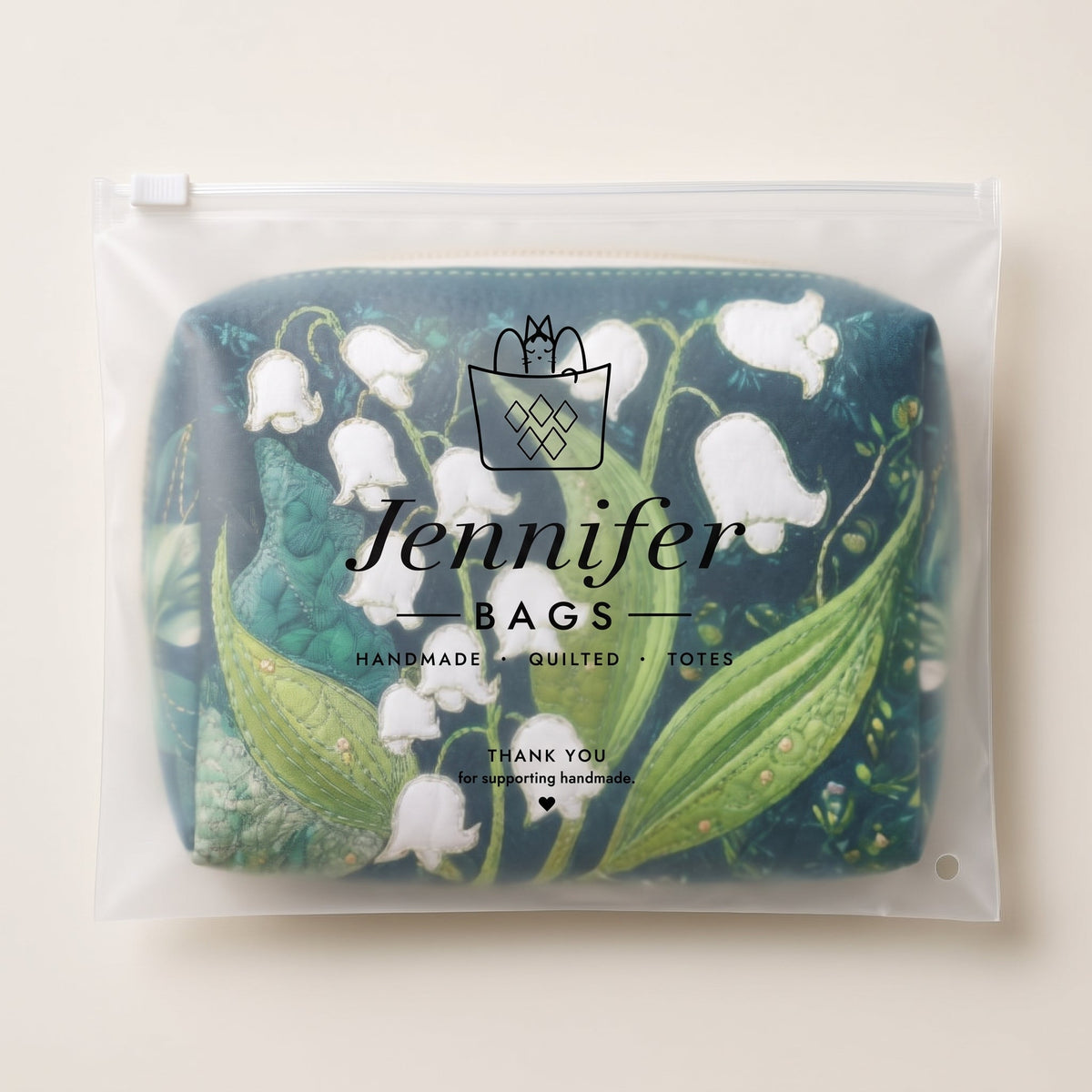 Lily Grace Quilted Makeup Bag — packaged in its pouch